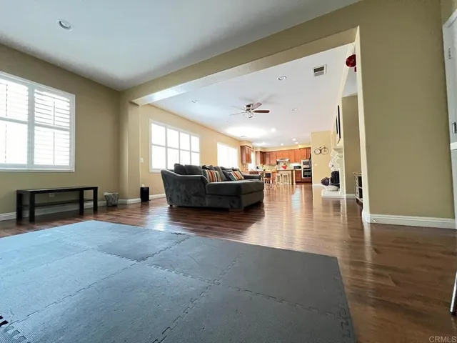 a bedroom with a bed and mirror