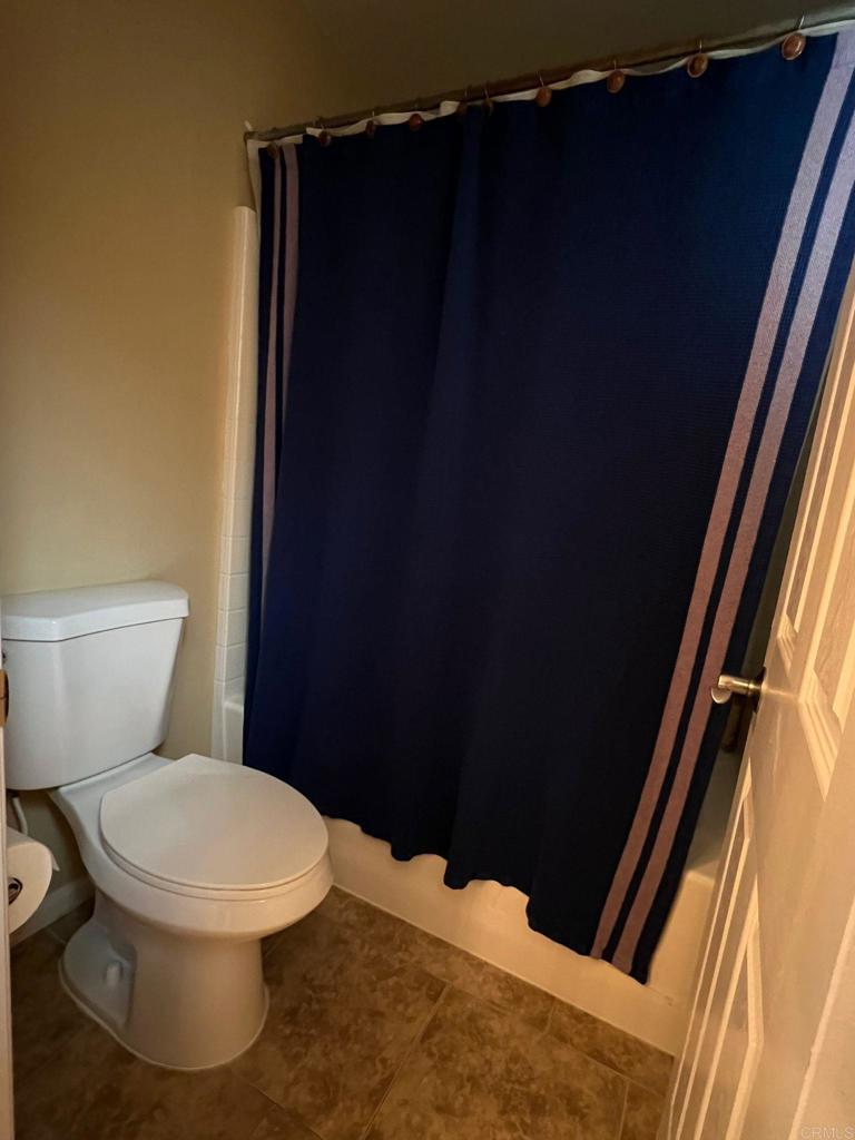 2436 Crooked Trail Road Chula Vista, CA 91914 - Photo 19 of 47 a white toilet sitting next to a small shower