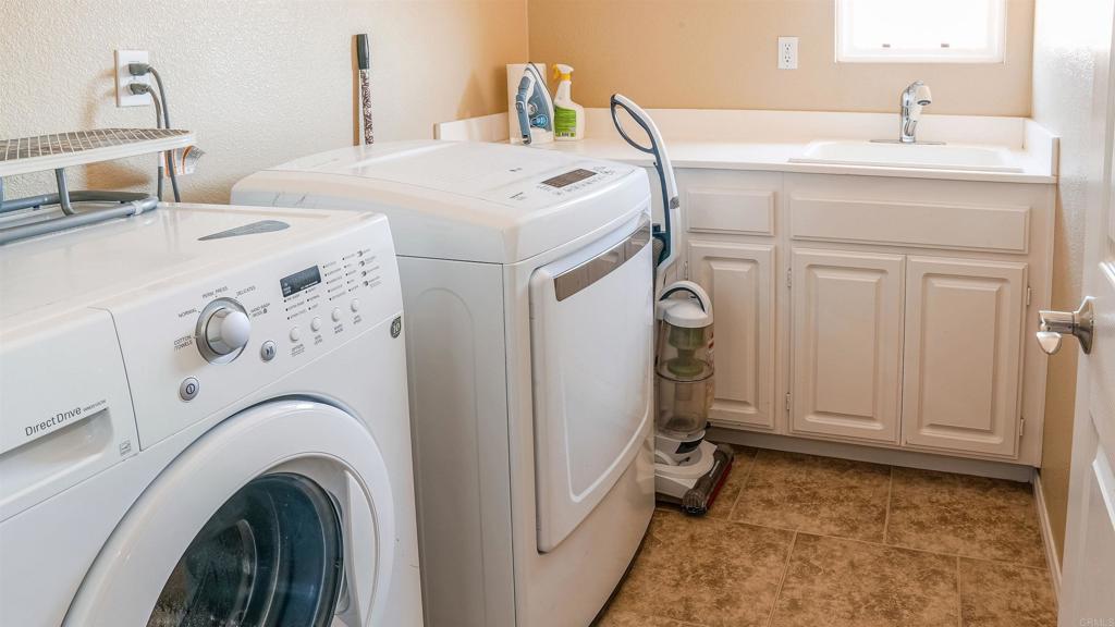 2436 Crooked Trail Road Chula Vista, CA 91914 - Photo 22 of 47 a utility room with dryer and washer