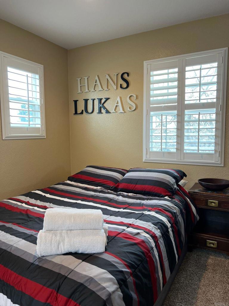 2436 Crooked Trail Road Chula Vista, CA 91914 - Photo 23 of 47 a bedroom with a bed and a window