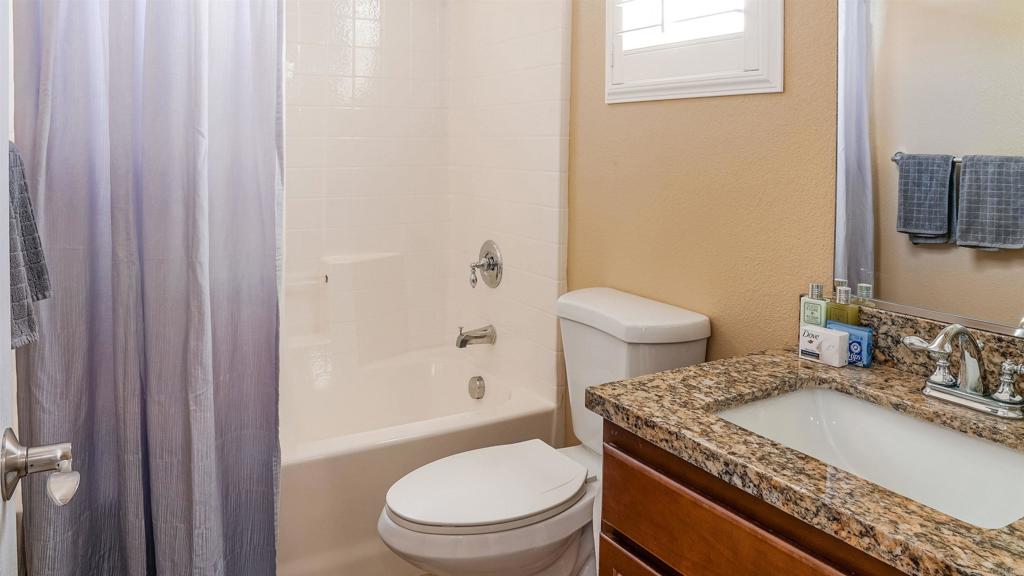 2436 Crooked Trail Road Chula Vista, CA 91914 - Photo 25 of 47 a bathroom with a granite countertop sink toilet and shower