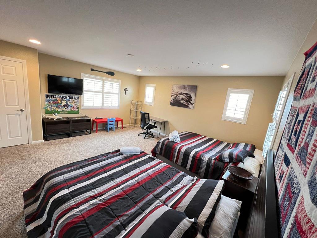 2436 Crooked Trail Road Chula Vista, CA 91914 - Photo 28 of 47 a bedroom with bed and a flat screen tv
