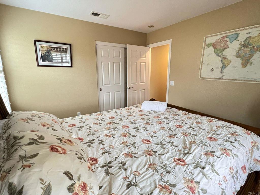 2436 Crooked Trail Road Chula Vista, CA 91914 - Photo 30 of 47 a bedroom with a bed and painting on the wall