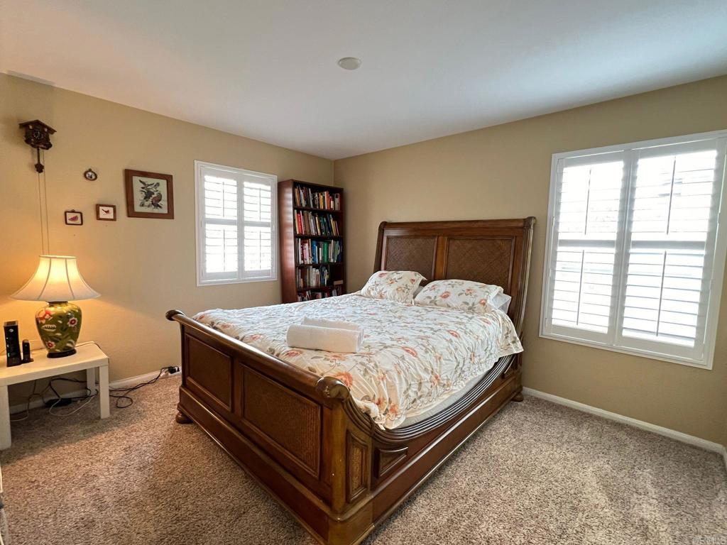 2436 Crooked Trail Road Chula Vista, CA 91914 - Photo 32 of 47 a bed sitting in a bedroom next to a window