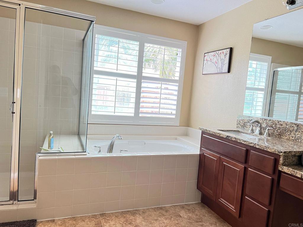 2436 Crooked Trail Road Chula Vista, CA 91914 - Photo 39 of 47 a bath tub sitting in a bathroom next to a window