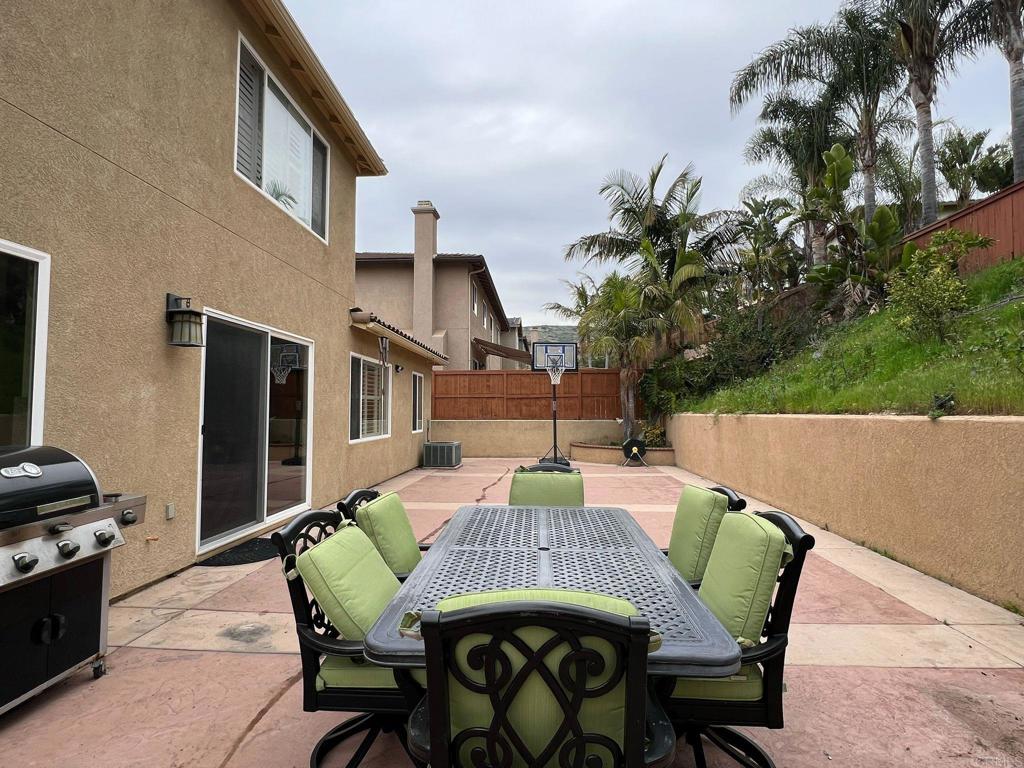 2436 Crooked Trail Road Chula Vista, CA 91914 - Photo 44 of 47 a view of a patio with a table and chairs