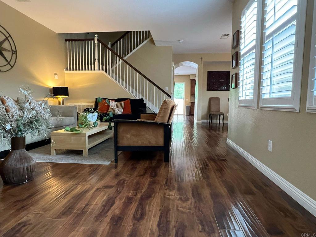 2436 Crooked Trail Road Chula Vista, CA 91914 - Photo 6 of 47 a living room with furniture and a wooden floor