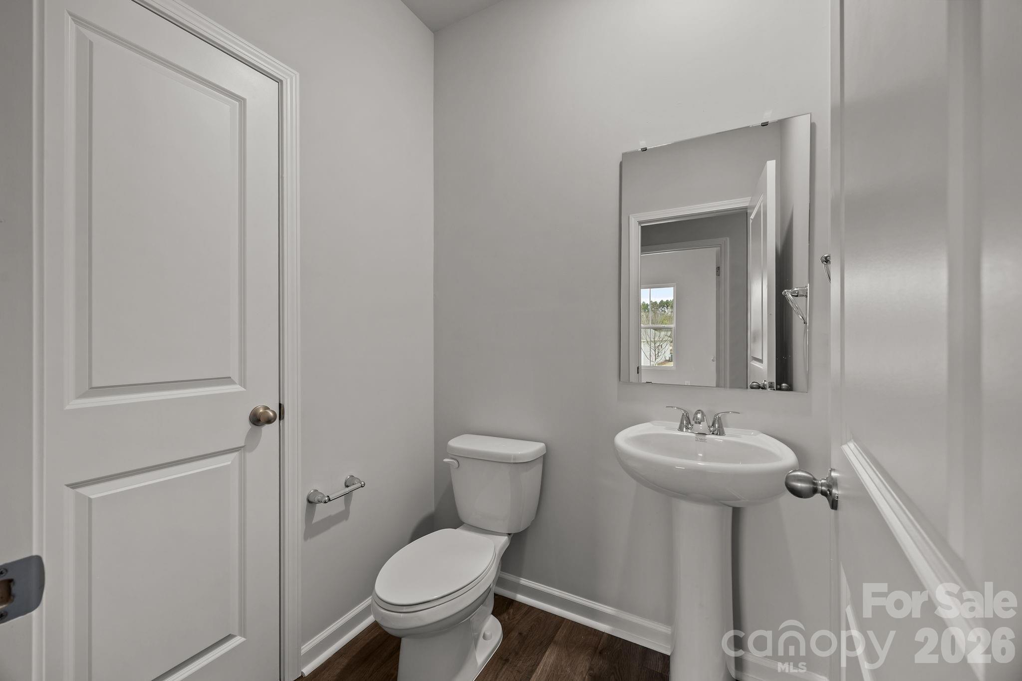 2680 Trawler Way Kannapolis, NC 28083 - Photo 8 of 16 a bathroom with a toilet sink and mirror