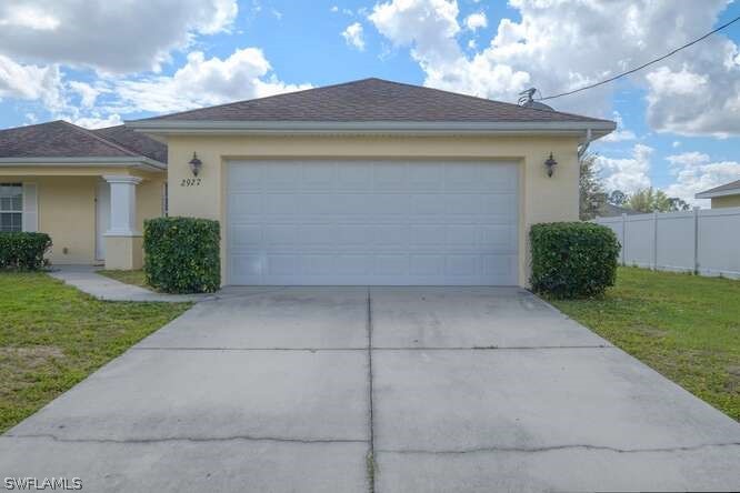 2927 4th Street Southwest Lehigh Acres, FL 33976 - Photo 1 of 19 a view of a house with a yard
