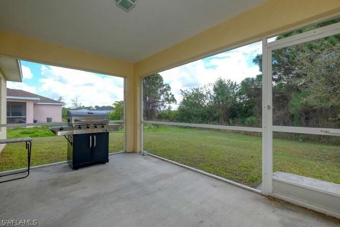 2927 4th Street Southwest Lehigh Acres, FL 33976 - Photo 14 of 19 a view of a porch with furniture and garden