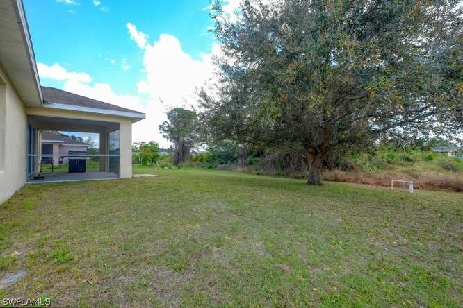 2927 4th Street Southwest Lehigh Acres, FL 33976 - Photo 19 of 19 a view of outdoor space and yard