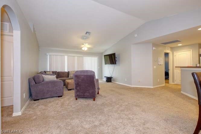 2927 4th Street Southwest Lehigh Acres, FL 33976 - Photo 2 of 19 a living room with furniture window and a view of kitchen