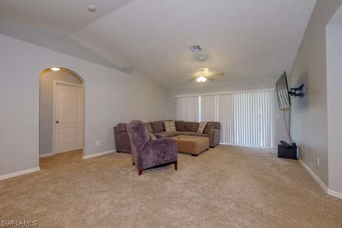 2927 4th Street Southwest Lehigh Acres, FL 33976 - Photo 3 of 19 a living room with furniture and a window