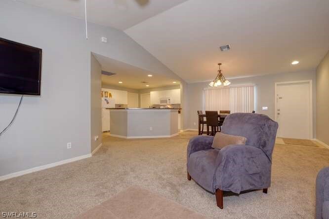 2927 4th Street Southwest Lehigh Acres, FL 33976 - Photo 6 of 19 a living room with furniture and a flat screen tv