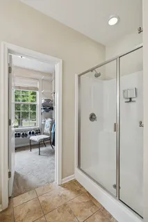 a bathroom with a bathtub and a window