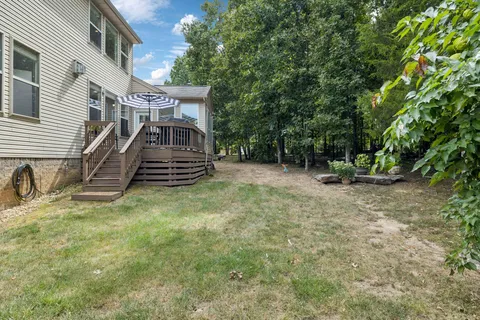 a backyard of a house with lots of green space