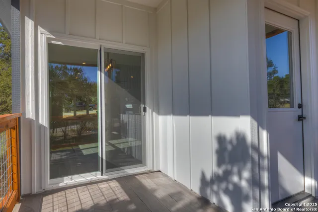 a view of a glass door of the house