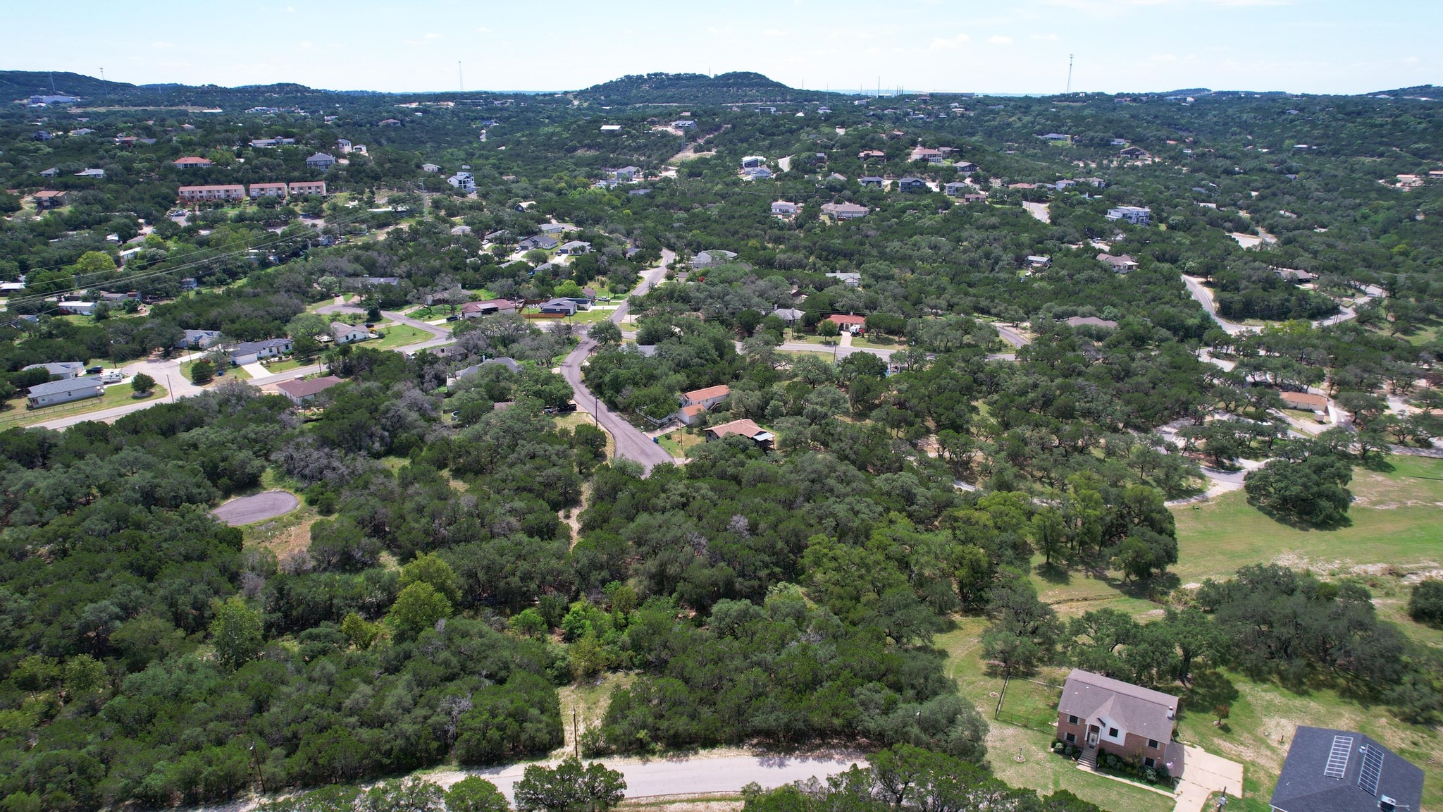 6719 Bar K Ranch Road Lago Vista, TX 78645 - Photo 12 of 36 an aerial view of residential houses with outdoor space and trees