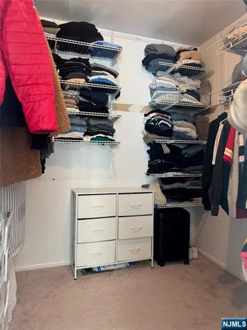 a bedroom with a bed and a table