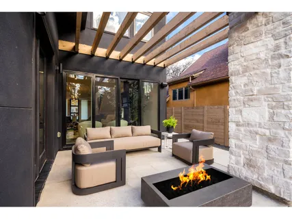 a living room filled with furniture and a potted plant