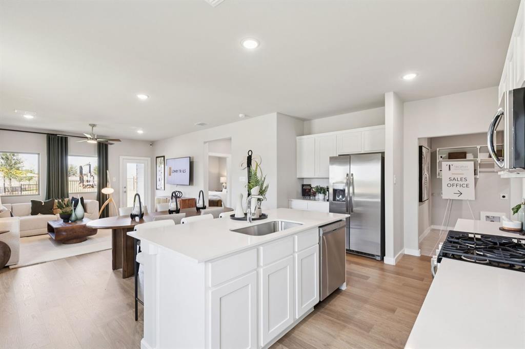 8204 Coastal Lane Pilot Point, TX 76258 - Photo 8 of 32 Kitchen in the Magnolia home plan by Trophy Signature Homes – REPRESENTATIVE PHOTO