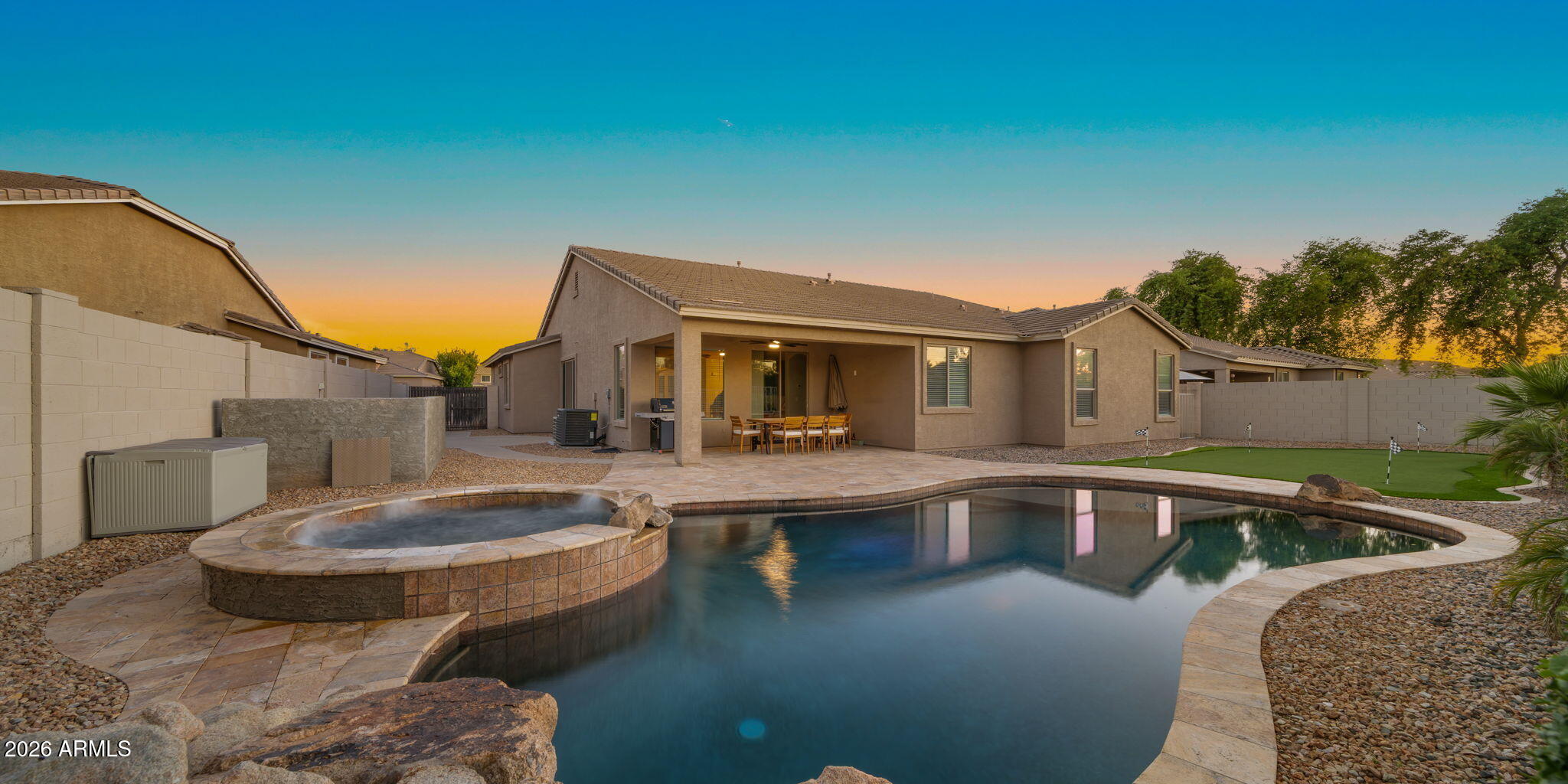 3344 East Hopkins Road Gilbert, AZ 85295 - Photo 24 of 32 a front view of house with swimming pool yard fire pit and outdoor seating