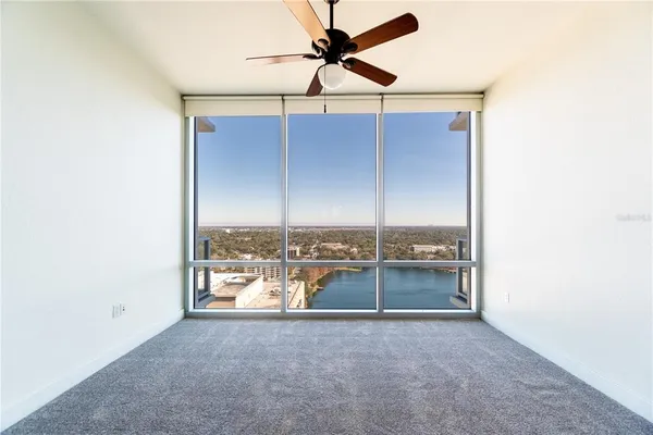 a bathroom with a granite countertop sink mirror and bathtub