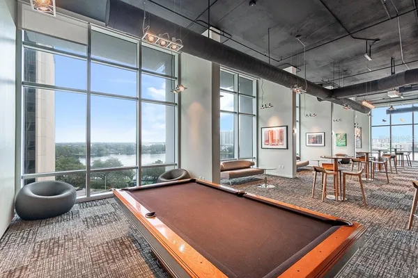 a view of a room with lots of wooden furniture