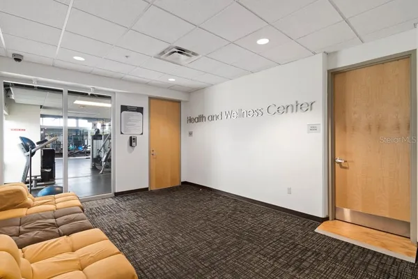a view of gym room with gym equipment