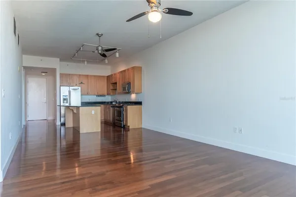 a view of kitchen and dining room with wooden floor