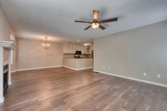 a view of a kitchen with a dishwasher cabinets and wooden floor