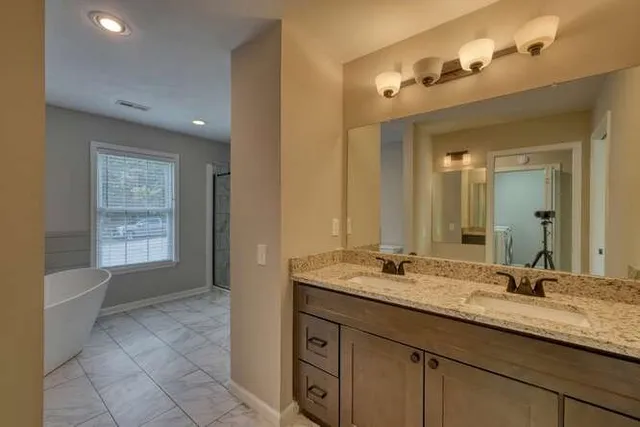 a white bath tub sitting in a bathroom