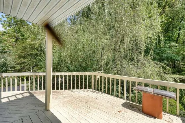 a backyard of a house with outdoor seating and plants