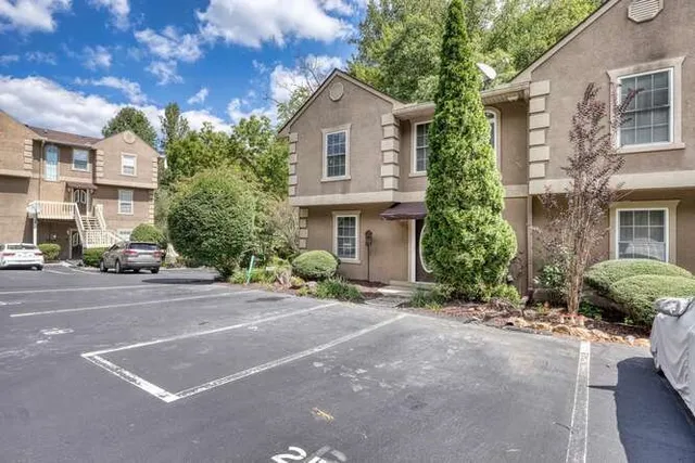 a front view of a house with a yard and a garage