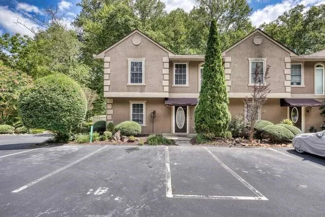 a balcony with trees in front of it