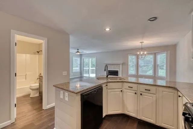 a kitchen with granite countertop white cabinets and a granite counter tops