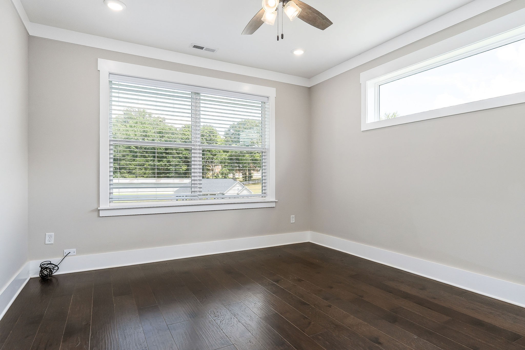 733 Jackson Avenue Carthage, TN 37030 - Photo 20 of 47 a view of an empty room with wooden floor and a window