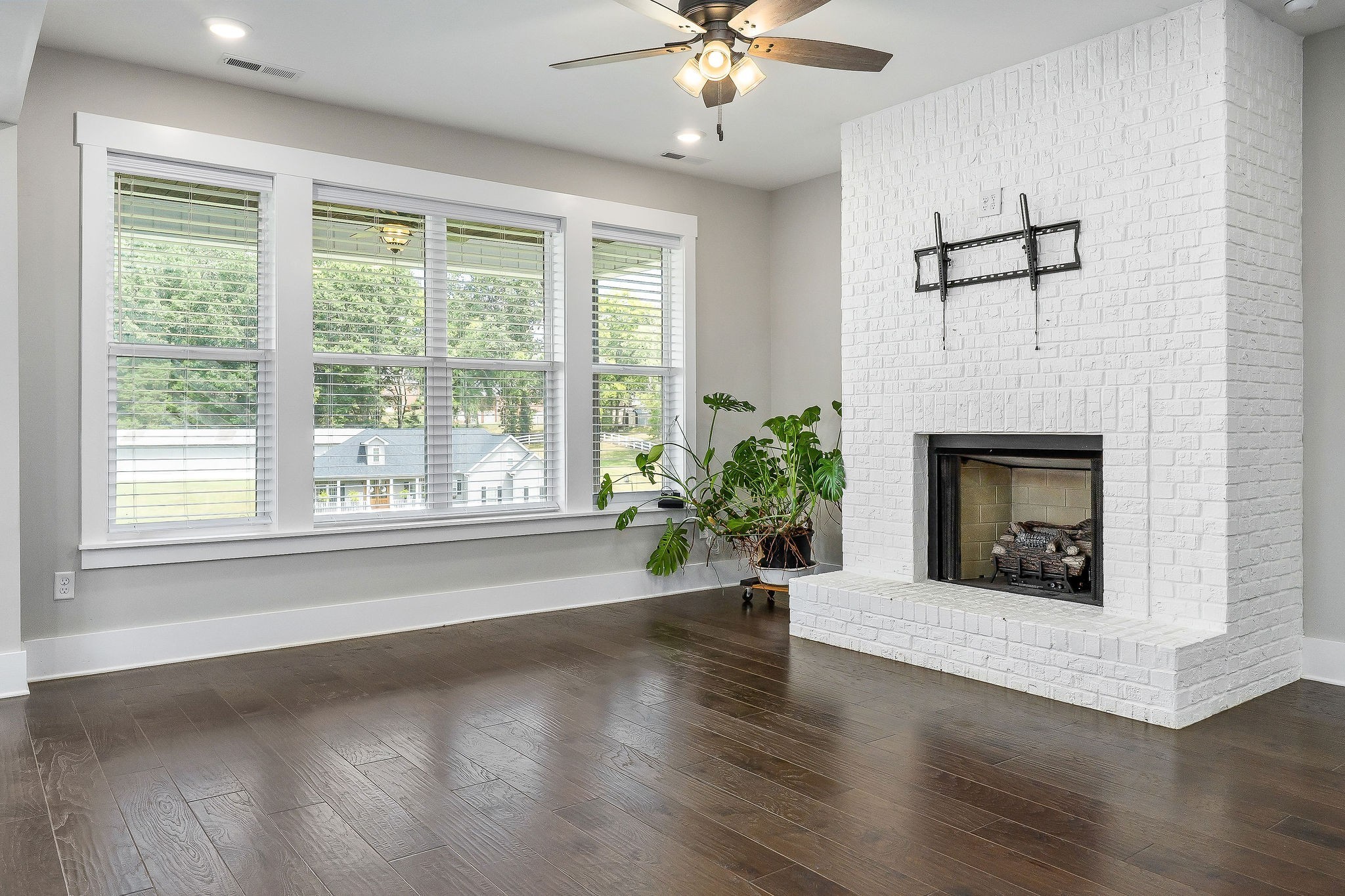 733 Jackson Avenue Carthage, TN 37030 - Photo 32 of 47 a view of a livingroom with a fireplace and wooden floor