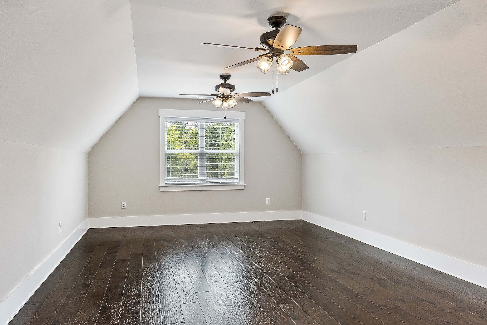 733 Jackson Avenue Carthage, TN 37030 - Photo 5 of 47 an empty room with wooden floor fan and windows