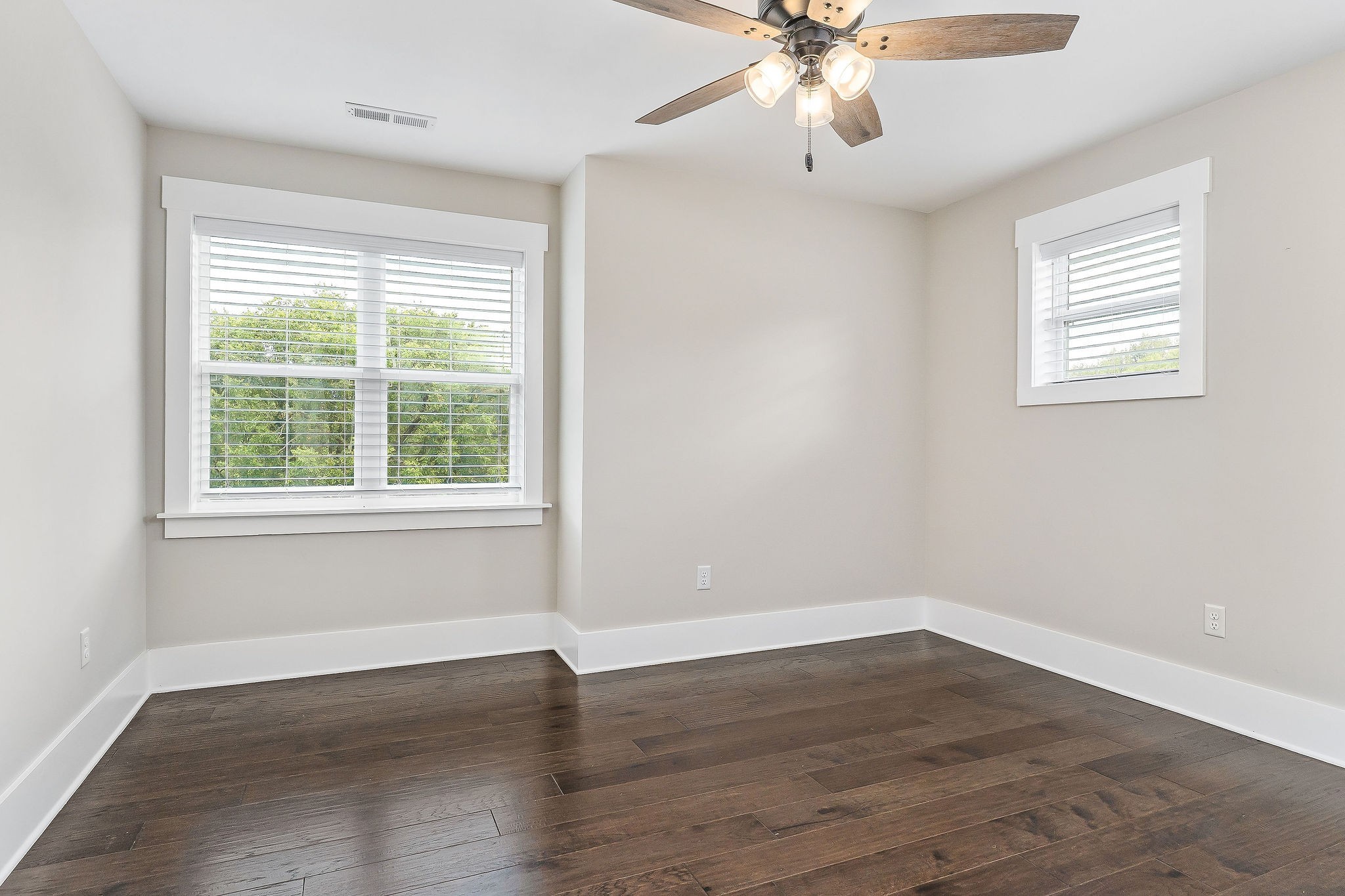 733 Jackson Avenue Carthage, TN 37030 - Photo 6 of 47 a view of an empty room with wooden floor and a window