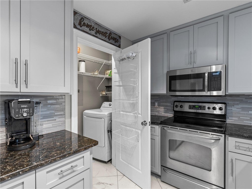 390 Marina Point Road, Unit D201 Dadeville, AL 36853 - Photo 10 of 44 kitchen and laundry
