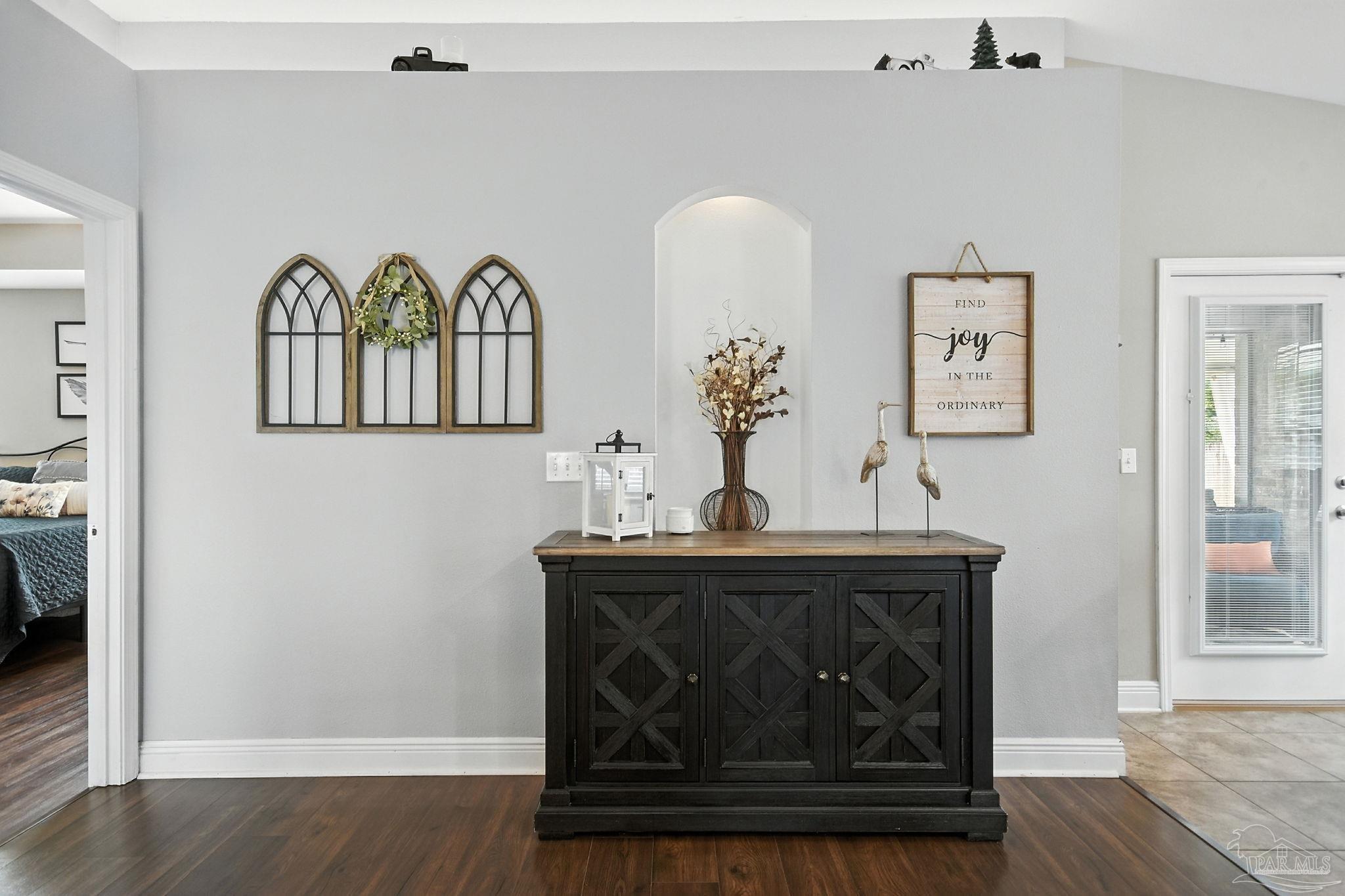 2587 Fiddlers Circle Cantonment, FL 32533 - Photo 14 of 66 a view of dining table chairs and wooden floor