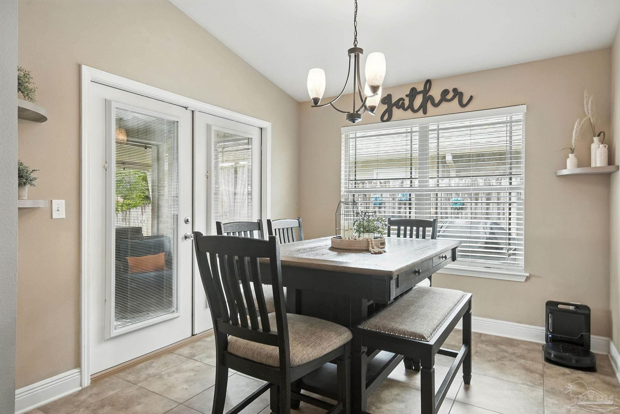2587 Fiddlers Circle Cantonment, FL 32533 - Photo 17 of 66 a view of a dining room with furniture window and outside view