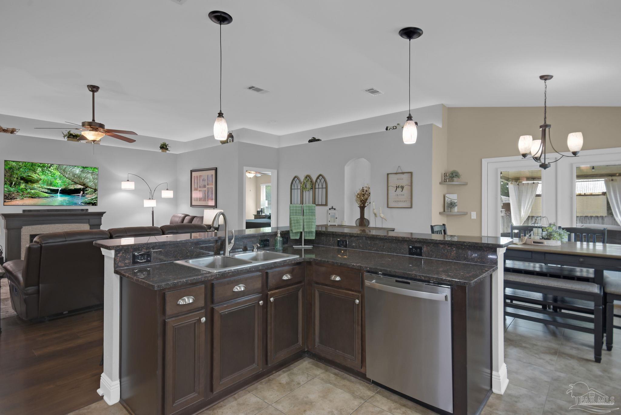 2587 Fiddlers Circle Cantonment, FL 32533 - Photo 28 of 66 a kitchen with a sink and stove