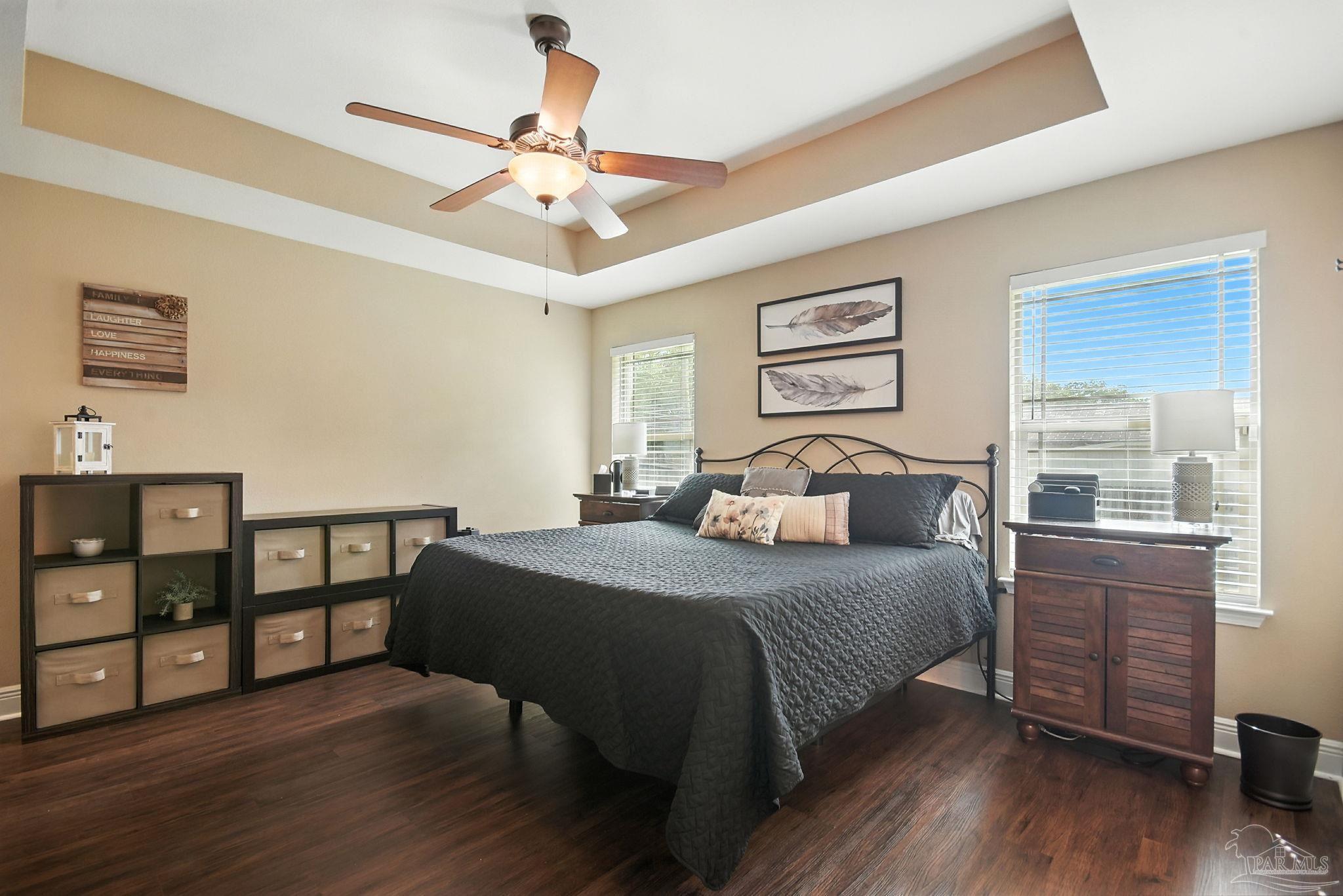2587 Fiddlers Circle Cantonment, FL 32533 - Photo 29 of 66 a bedroom with a bed and wooden floor