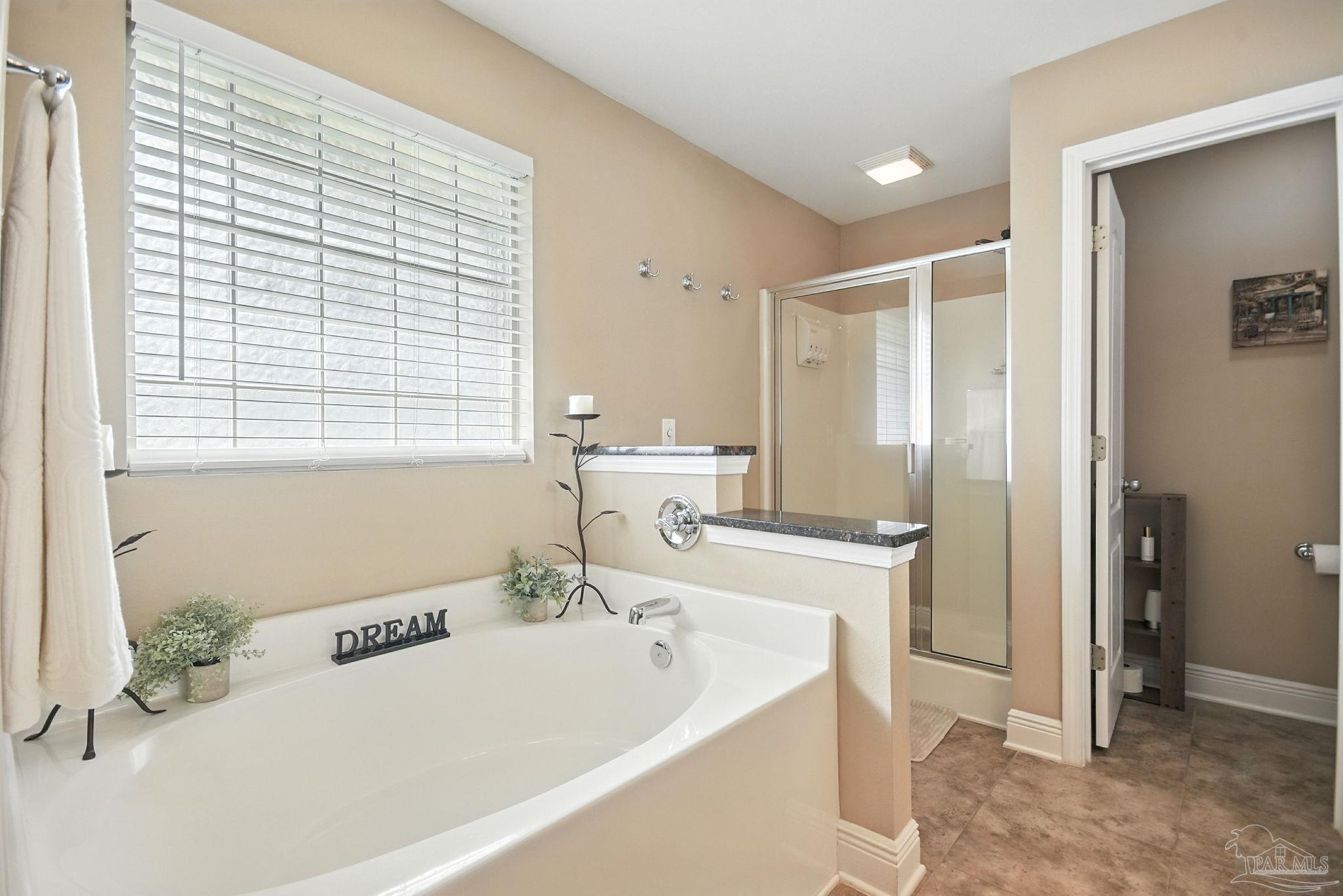 2587 Fiddlers Circle Cantonment, FL 32533 - Photo 37 of 66 a bathroom with a tub sink and mirror