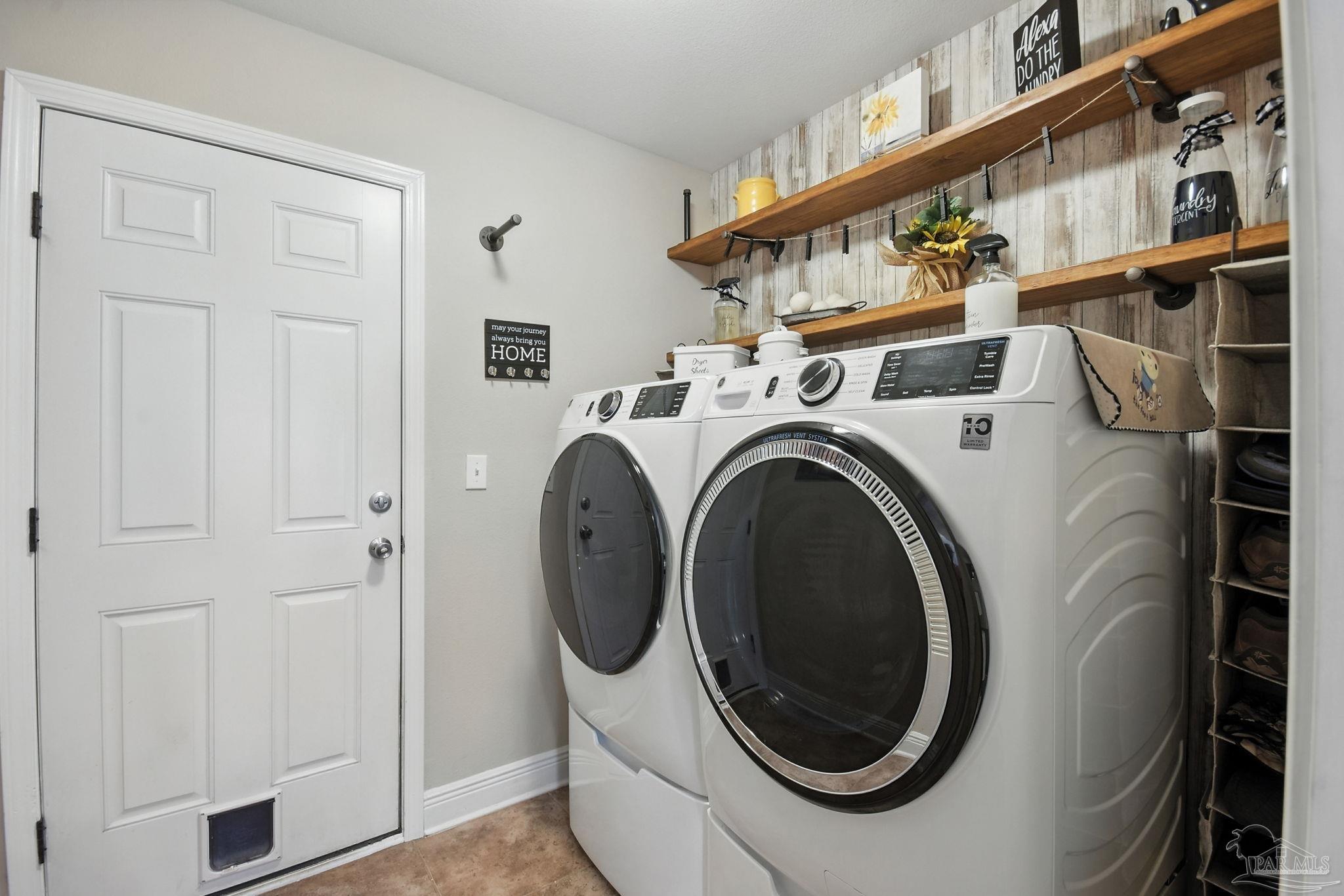 2587 Fiddlers Circle Cantonment, FL 32533 - Photo 44 of 66 a utility room with dryer and washer