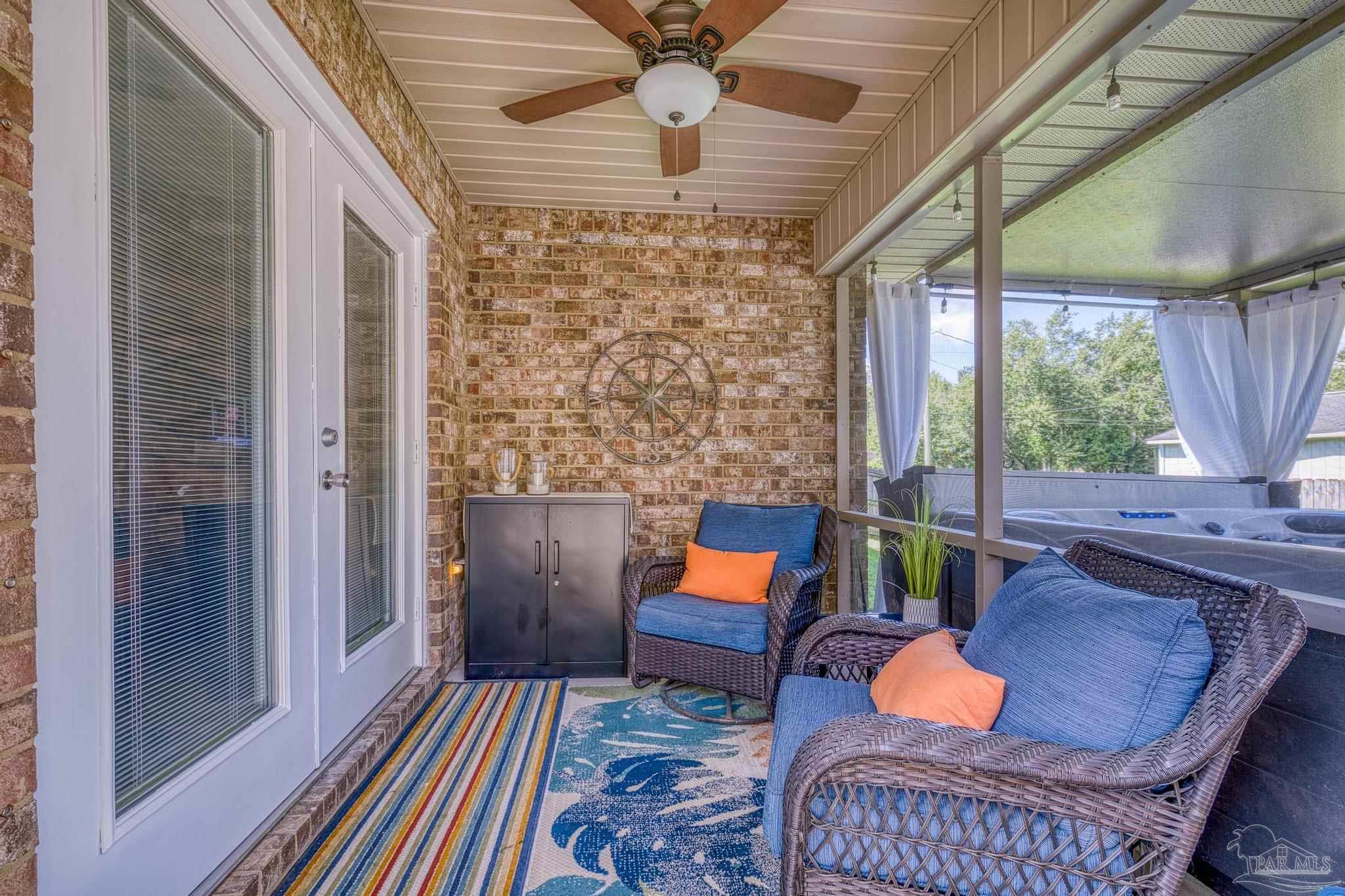 2587 Fiddlers Circle Cantonment, FL 32533 - Photo 46 of 66 a living room filled with furniture and a rug