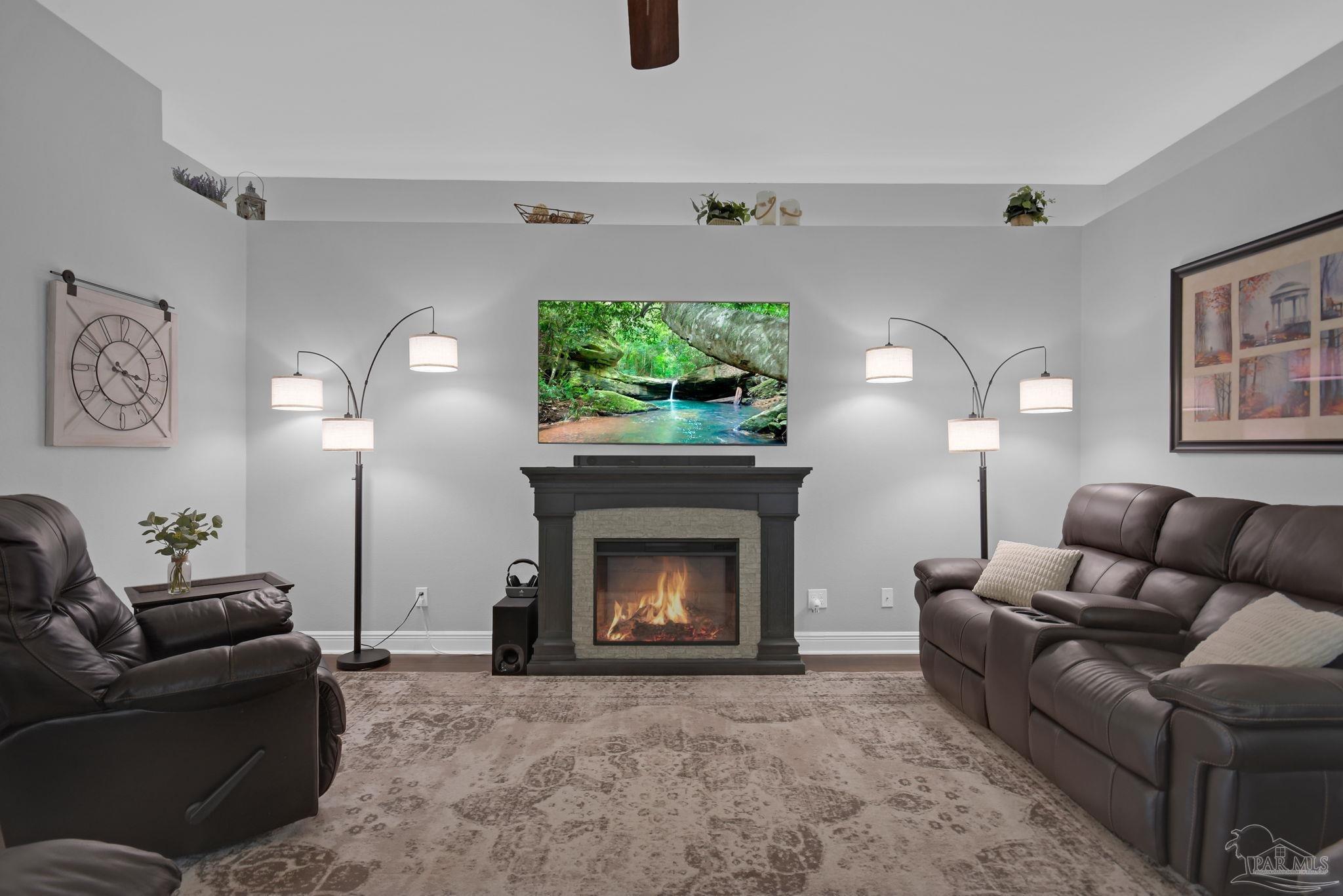 2587 Fiddlers Circle Cantonment, FL 32533 - Photo 9 of 66 a living room with furniture a window and a fireplace
