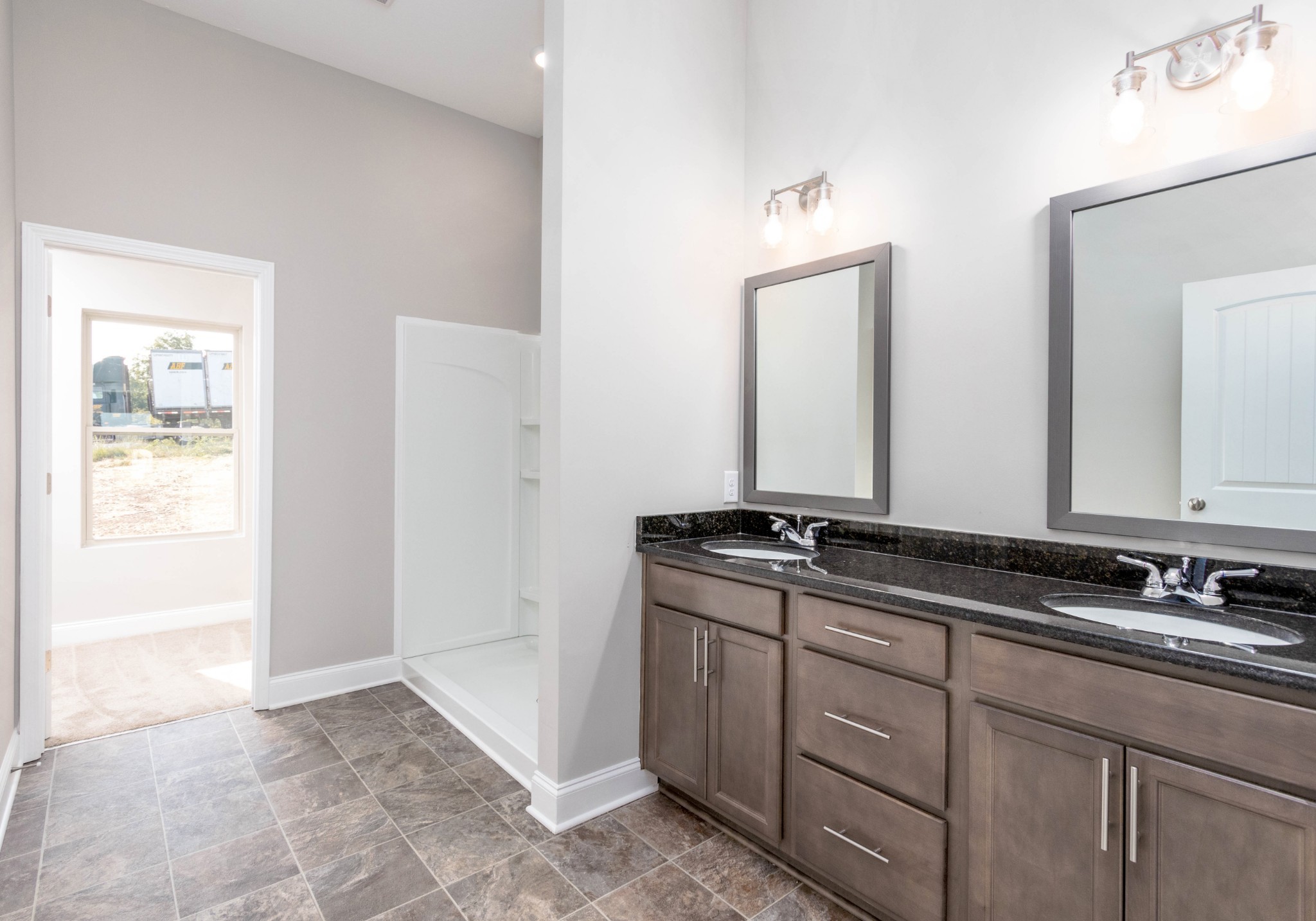 1023 East Piney Road Dickson, TN 37055 - Photo 10 of 19 a bathroom with double sink and a mirror